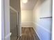 Bright bathroom featuring a glass enclosed shower and wood-look flooring at 6868 Sky Pointe Dr # 1118, Las Vegas, NV 89131