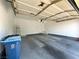 Spacious two car garage providing ample room for vehicles and storage, with overhead door and access door at 6868 Sky Pointe Dr # 1118, Las Vegas, NV 89131