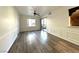 Living area showcases wood-look flooring, decorative trim, and sliding door to the balcony at 6868 Sky Pointe Dr # 1118, Las Vegas, NV 89131