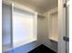 Walk-in closet featuring built-in shelves, hanging rods and carpeted floors for organized storage at 6868 Sky Pointe Dr # 1118, Las Vegas, NV 89131