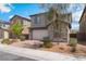 Charming two-story home featuring desert landscaping, stone accents and a brick paver driveway at 7132 Sayonara Vista St, North Las Vegas, NV 89084