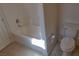 Bathroom with a shower and toilet with tiled flooring at 72 Broken Putter Way, Las Vegas, NV 89148