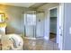 Bathroom featuring a corner shower, a soaking tub, and a view into the walk-in closet at 72 Broken Putter Way, Las Vegas, NV 89148