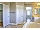 Bathroom featuring a soaking tub with white tile flooring and a large closet at 72 Broken Putter Way, Las Vegas, NV 89148
