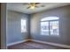 Bedroom with neutral carpet and two windows at 72 Broken Putter Way, Las Vegas, NV 89148