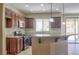 Well-appointed kitchen featuring granite countertops, stainless steel appliances, and dark cabinetry, perfect for cooking at 72 Broken Putter Way, Las Vegas, NV 89148