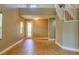 Bright living area featuring neutral walls, tile floors, and a staircase, creating an airy and inviting space at 72 Broken Putter Way, Las Vegas, NV 89148