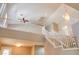 Stunning staircase with white railings, high ceilings, chandelier, and ample natural light creating an elegant ambiance at 72 Broken Putter Way, Las Vegas, NV 89148