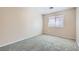 Carpeted bedroom featuring a double-hung window that provides natural light at 7547 Rolling River Dr, Las Vegas, NV 89131