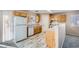 Well-equipped kitchen with wood cabinets, an efficient layout, and new flooring at 7547 Rolling River Dr, Las Vegas, NV 89131