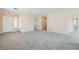Open and bright living space with new carpet flooring and multiple entryways at 7547 Rolling River Dr, Las Vegas, NV 89131