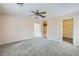 Large main bedroom featuring neutral walls, soft gray carpet, and doorways to the bath and closet at 7547 Rolling River Dr, Las Vegas, NV 89131