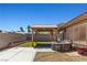 A charming backyard setup featuring a pergola, hot tub, and patio area at 7825 White Grass Ave, Las Vegas, NV 89131