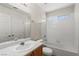 Clean bathroom featuring a vanity with sink, a mirror and a shower-tub combo at 7825 White Grass Ave, Las Vegas, NV 89131