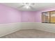 Cozy bedroom featuring pink walls and a window with blinds at 7825 White Grass Ave, Las Vegas, NV 89131