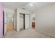 Spacious bedroom featuring carpet floors, closet, and adjacent bathroom at 7825 White Grass Ave, Las Vegas, NV 89131