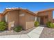 Inviting single-story home entrance with a secure gate and desert landscaping at 7825 White Grass Ave, Las Vegas, NV 89131