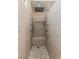Walk-in shower featuring tiled walls, a pebbled floor, a rain shower, and body jets at 7825 White Grass Ave, Las Vegas, NV 89131