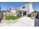 Spacious backyard featuring a covered patio, artificial grass, and playful swing set at 7849 Meandering Light Ave, Las Vegas, NV 89131