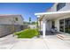 Inviting backyard featuring a covered patio, artificial grass, and playful swing set at 7849 Meandering Light Ave, Las Vegas, NV 89131