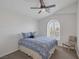 Bright bedroom featuring unique wall paneling and a cozy window seat at 7849 Meandering Light Ave, Las Vegas, NV 89131
