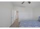Bedroom showcases modern design, bright accents, and doorway access to a hallway at 7849 Meandering Light Ave, Las Vegas, NV 89131