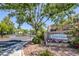 Inviting Lamplight Village entrance with lush landscaping and a well-maintained community sign at 7849 Meandering Light Ave, Las Vegas, NV 89131
