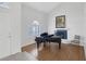 Elegant living room featuring hardwood floors and a fireplace, next to the foyer at 7849 Meandering Light Ave, Las Vegas, NV 89131