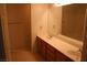 Bathroom with double sinks, wooden cabinets, vanity mirror, and a separate shower/tub enclosure at 830 Carnegie St # 1011, Henderson, NV 89052