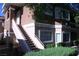 Two-story condo with stairs leading to the second level, featuring stucco siding and well-maintained landscaping at 830 Carnegie St # 1011, Henderson, NV 89052