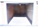 An empty, single-car garage providing secure parking or extra storage space at 830 Carnegie St # 1011, Henderson, NV 89052