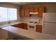 Bright kitchen with ample countertop space, wooden cabinets, and modern appliances including a gas range at 830 Carnegie St # 1011, Henderson, NV 89052