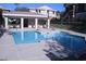 Relaxing swimming pool with ample seating and shade for hot days at 830 Carnegie St # 1011, Henderson, NV 89052