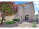 The backyard includes pavers and easy-to-maintain gravel and manicured shrubbery at 8562 Burning Bridge Ct, Las Vegas, NV 89131