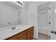 Bathroom features a large mirror, updated fixtures, and combined shower and tub at 8562 Burning Bridge Ct, Las Vegas, NV 89131