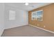 Carpeted bedroom features a large window with blinds and a two-tone paint design at 8562 Burning Bridge Ct, Las Vegas, NV 89131
