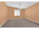 Cozy dining area with stylish chandelier and plush carpeting at 8562 Burning Bridge Ct, Las Vegas, NV 89131