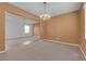 Spacious dining area with plush carpet, a chandelier, and lots of natural light at 8562 Burning Bridge Ct, Las Vegas, NV 89131