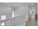 Upstairs hallway featuring white walls, and neutral tiled floors at 8562 Burning Bridge Ct, Las Vegas, NV 89131