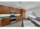 Bright kitchen featuring stainless appliances, tile floors, and abundant counter space for cooking at 8562 Burning Bridge Ct, Las Vegas, NV 89131