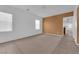 Inviting living room with large windows and neutral carpeting at 8562 Burning Bridge Ct, Las Vegas, NV 89131