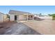 Backyard view of a home featuring a covered patio, framed by a block wall at 905 Harp Way, North Las Vegas, NV 89032