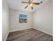 Cozy bedroom with ceiling fan, fresh paint, and durable flooring for a modern look at 905 Harp Way, North Las Vegas, NV 89032
