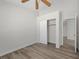 Bedroom featuring neutral walls, ceiling fan, and closet with sliding doors at 905 Harp Way, North Las Vegas, NV 89032