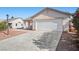 Beautiful home with two-car garage and low maintenance yard at 905 Harp Way, North Las Vegas, NV 89032