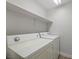 Laundry room featuring side-by-side washer and dryer with a shelf above at 905 Harp Way, North Las Vegas, NV 89032