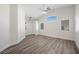 Bright living room with vaulted ceilings, fan, and lots of natural light from a large window at 905 Harp Way, North Las Vegas, NV 89032