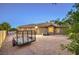Gravel backyard featuring lush landscaping, exterior of home, and patio area, perfect for outdoor living at 9135 Hickam Ave, Las Vegas, NV 89129