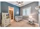 Charming Bedroom room with closet access, a crib, and a dresser at 9135 Hickam Ave, Las Vegas, NV 89129