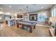 Billiard room features a pool table, custom lighting, and seamless access to the bar area at 9135 Hickam Ave, Las Vegas, NV 89129